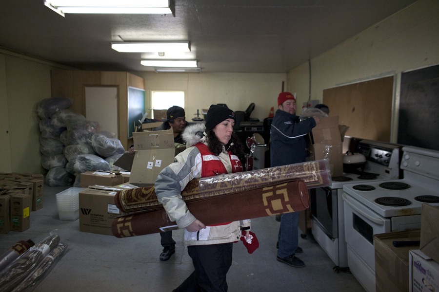 Red Cross volunteer Jenn Moore. The Red Cross is distributing items such as sleeping bags, floor mats, winter clothing