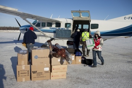 Red Cross volunteers bring supplies to the northern Ontario community of Attawapiskat. Photo by Johan Hallberg-Campbell