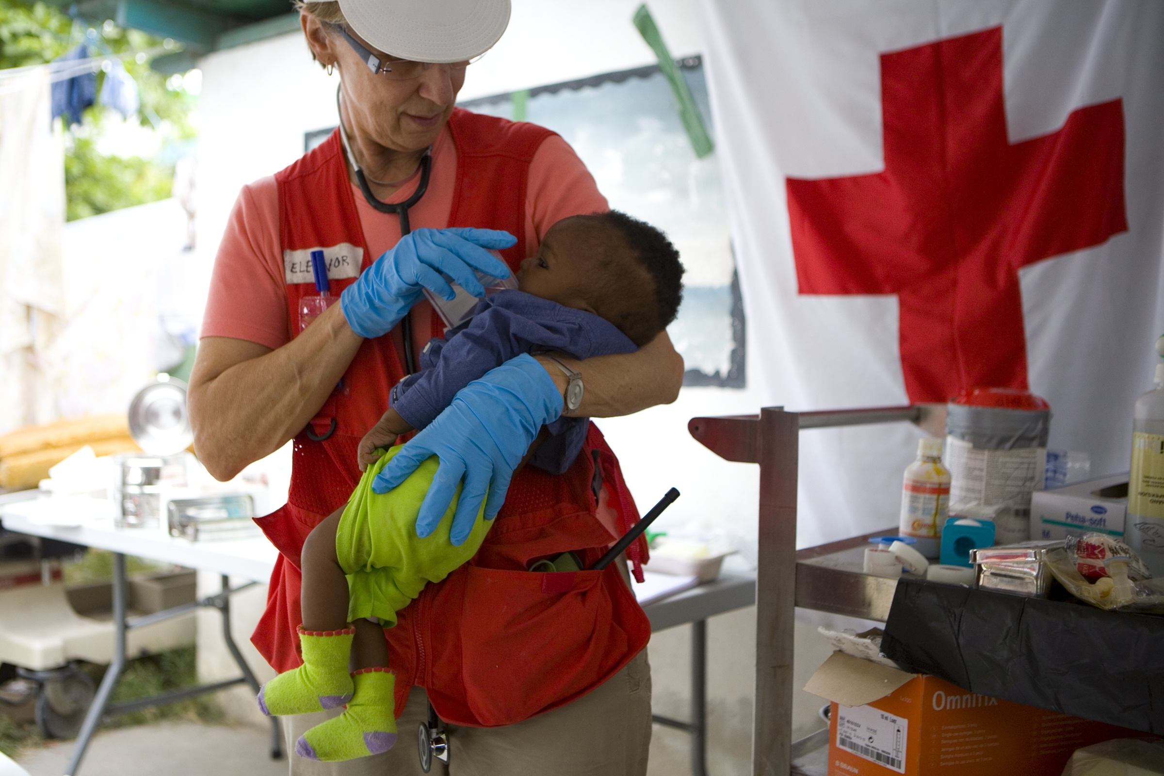 Eleanore Rose of the Canadian Red Cross holds six-month-old Sebastian Joseph at Hospital General in Haiti.  Sebastianâs mother was killed in the earthquake. January 19. Photo: Talia Frenkel/American Red Cross