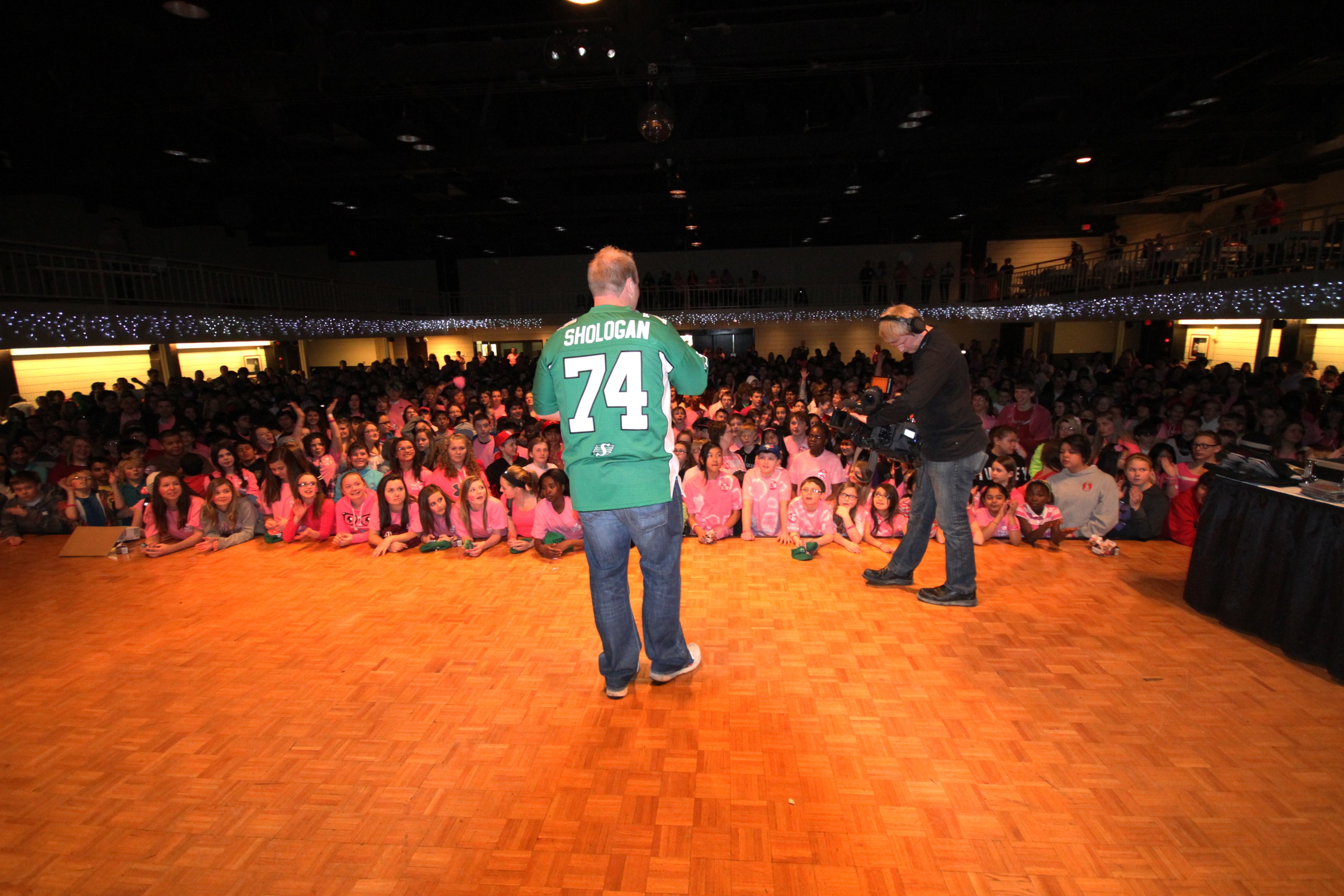 Saskatchewan Rough Rider's Defensive Tackle, Keith Shologan, speaks to over 1,000 students about bullying.