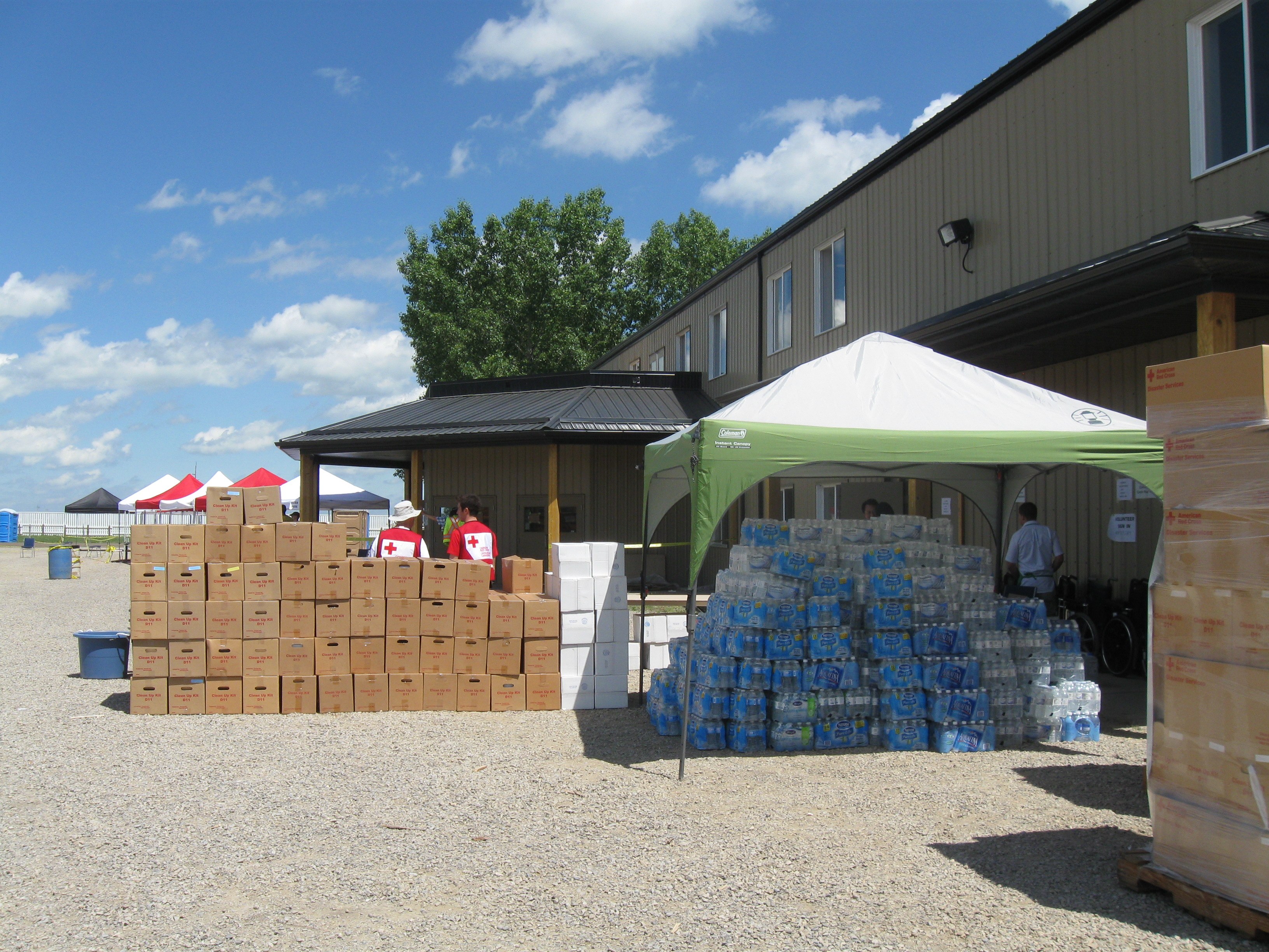 Clean-up kits, water and other supplies staged at the High River community re-entry centre