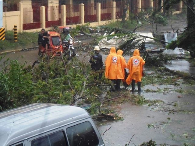 Philippine Red Cross workers assessing damage.