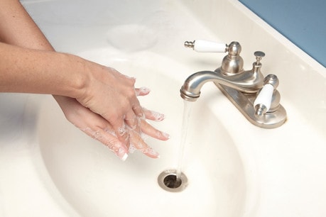 Hands demonstrating hand washing technique