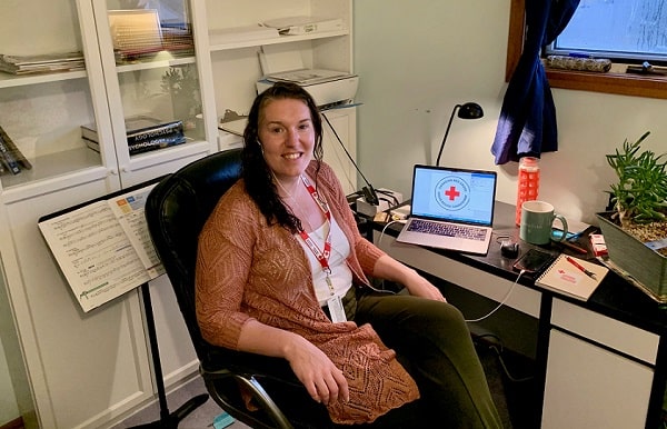 Saskatchewan volunteer Amanda McConnell in her home office where she makes her wellness check calls.