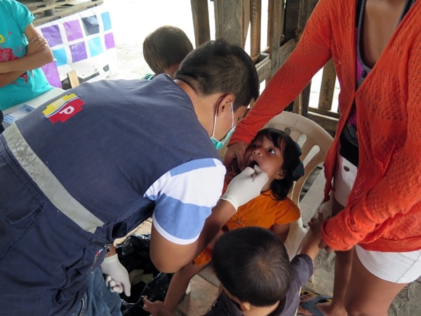 Local Ministry of Health dentist examines a patient