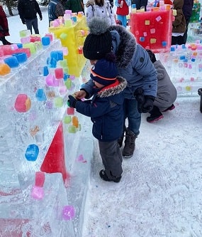Caption: Shurooq explores an ice castle with her son at Winterlude.