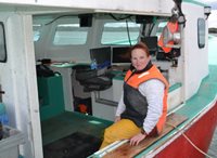 Fisher Tammy Saunders volunteers for Canadian Red Cross in her free time, pictured here on her boat.