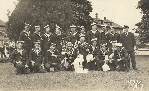 	Postcard of Muggins the Red Cross dog with members of the Royal Naval Canadian Volunteer Reserve (RNCVR)