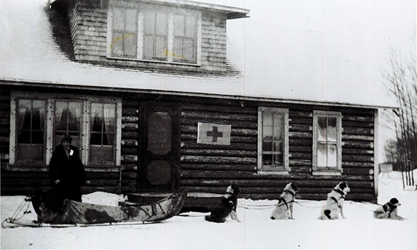 Outpost Hospital nurse with dog sled 