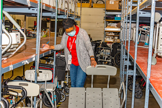 A Canadian Red Cross volunteer  working with the Health Equipment Loan Program