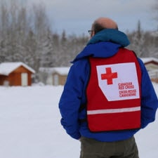 Red Cross volunteer standing in the snow