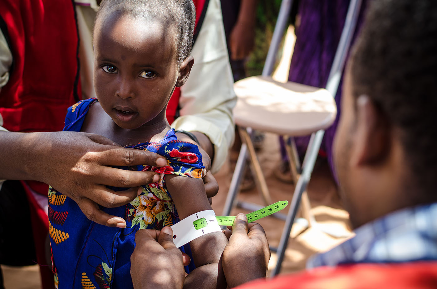 A young girl in Somalia is tested for malnutrition at a Red Cross Red Crescent mobile clinic.