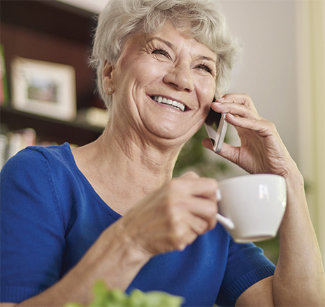 Senior lady talking on the phone while smiling