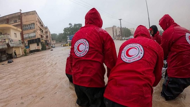 Five people with the Libyan Red Crescent assist during the flooding.