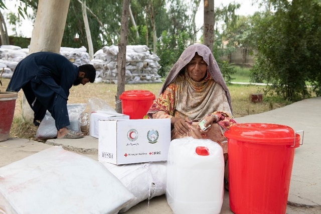 Older woman getting Red Cross supplies