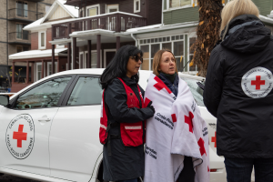 Canadian Red Cross employees comforting a woman