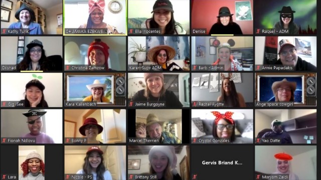 zoom call with many people wearing hats and smiling at the camera