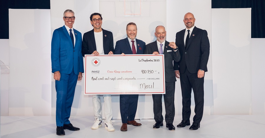 Five men holding a large check for the Canadian Red Cross