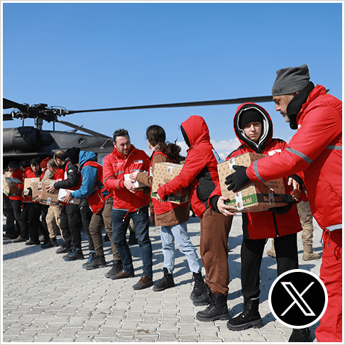 Turkish Red Cross staff loading a helicopter with boxes after the earthquake in Turkey and Syria