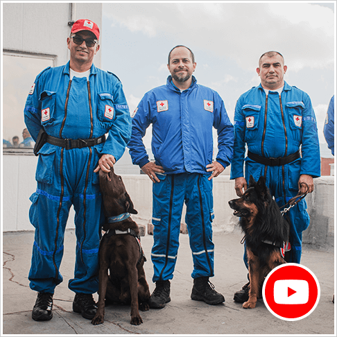 Colombian Red Cross staff members and two dogs ready to be deployed to Turkey after the earthquake