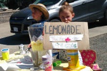 Two young girls selling Lemonade
