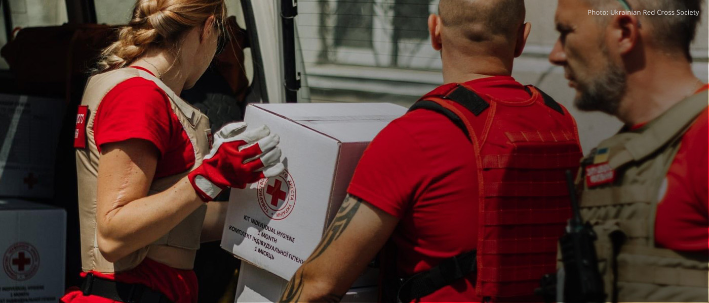 Ukrainian Red Cross workers transport humanitarian aid.