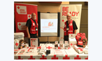 Tom Hamson and Henry van Deldan at a Red Cross booth