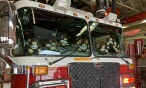 fire truck with stuffed bears in windshield