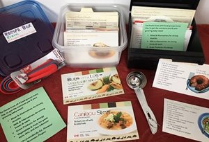 Recipes and recipe kits displayed on a table