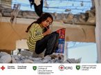 Young girl doing homework on a pile of rubble
