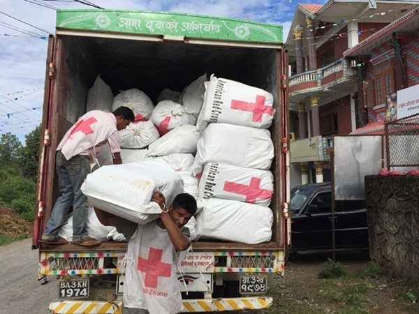 Nepal Red Cross volunteers unloading relief goods