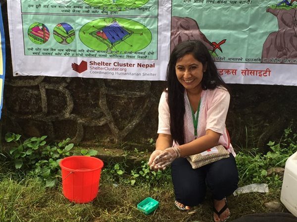 Nepal Red Cross technical officer Sarita Dhungana demonstrates hand washing