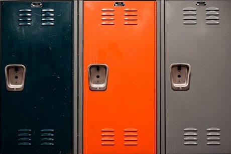 Close up on three lockers coloured black, orange and grey