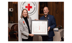 Ellie accepting her Order of the Red Cross award from Shawn Feeley, VP Manitoba and Nunavut