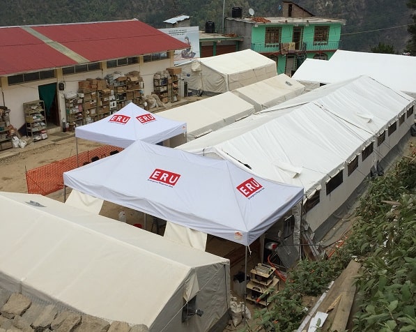 Field hospital tents set up on the mountain side