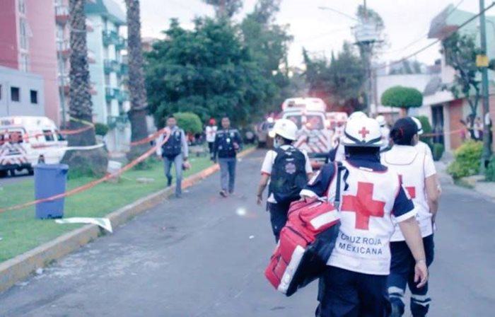 Emergency medical personnel from the Mexican Red Cross provide assistance