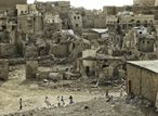Group of children playing in a war torn area