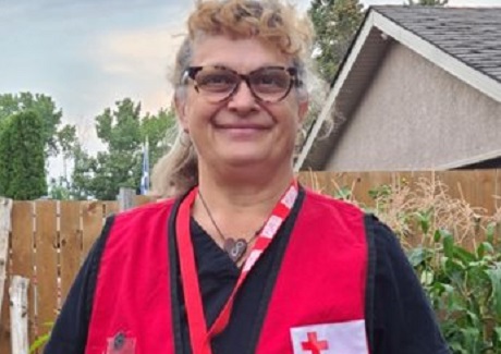 Kara smiling in her Red Cross red vest
