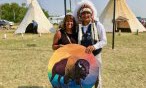 Cindy Fuchs and Chief Cadmus Delorme of Cowessess FN on Aug 15 pow wow 