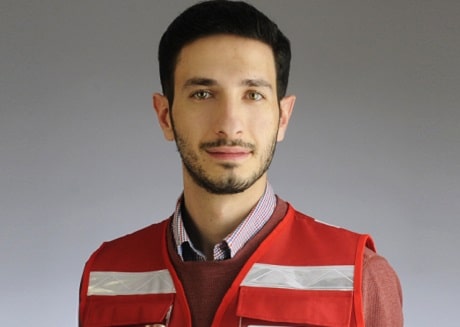Headshot of Rateb in a Canadian Red Cross red vest