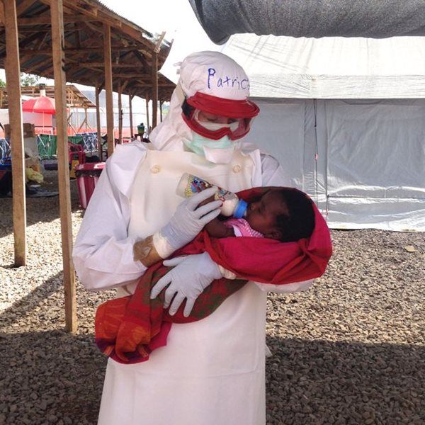 Canadian nurse Patrice with a baby infected by Ebola