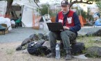 canadian red cross volunteer with laptop
