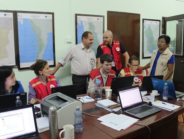 Nicolas Verdy, pictured back row in red vest, coordinates with global operations
