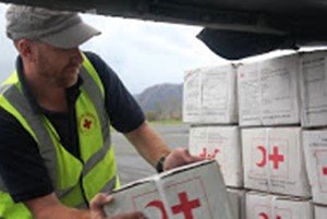 Nicolas helps move some of the 40 tonnes of relief items in Vanuatu. With only a 4-hour window to offload all the items from the plane, everyone lent a hand.