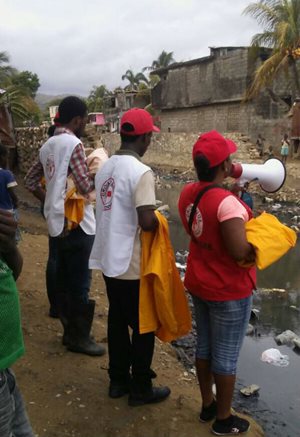 Haitian Red Cross volunteers warn residents prior to Hurricane Irma