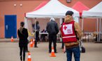 Red Cross volunteers provide clean-up kits to flood impacted residents in Fort McMurray in May 2021