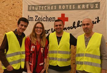 Volunteer translator Ahmad, Canadian Red Cross aid worker Sarah, volunteer translator Ibrahim, and Ahmad’s father Mahmoud.