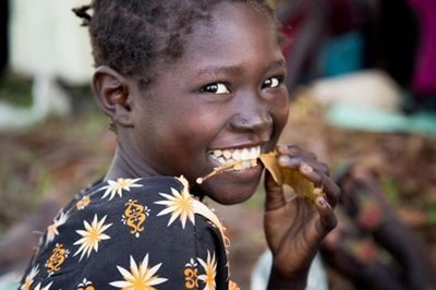 A girl smiles in South Sudan