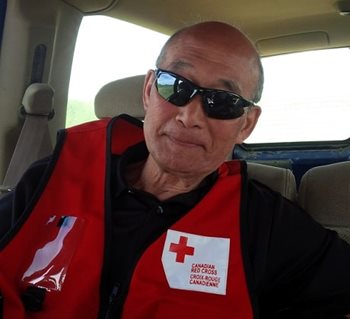 Canadian Red Cross volunteer Ted Itani in a red vest