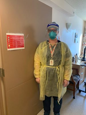 nurse in yellow gown and PPE